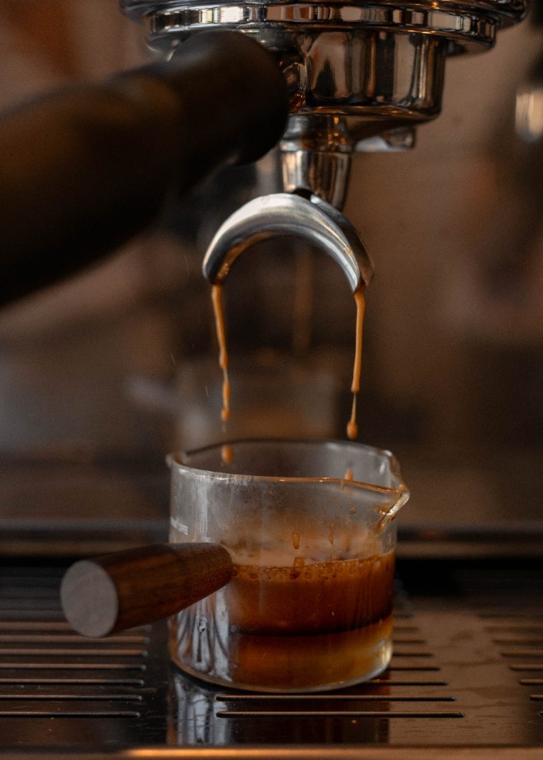 Espresso pulling into a glass pitcher