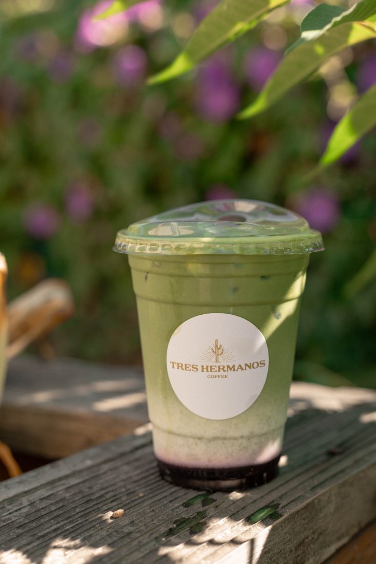 Iced matcha latte in a branded cup